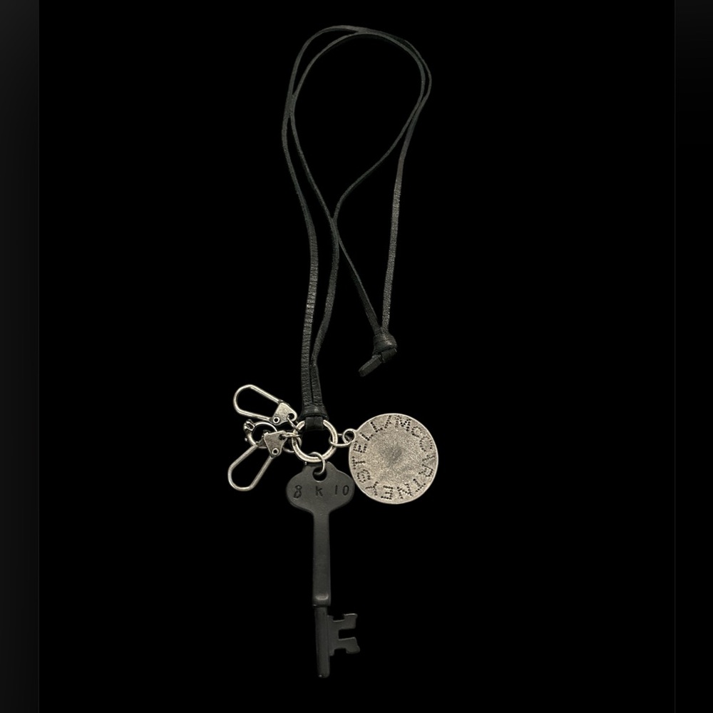 Stella McCartney black cord necklace with key logo medallion charms
